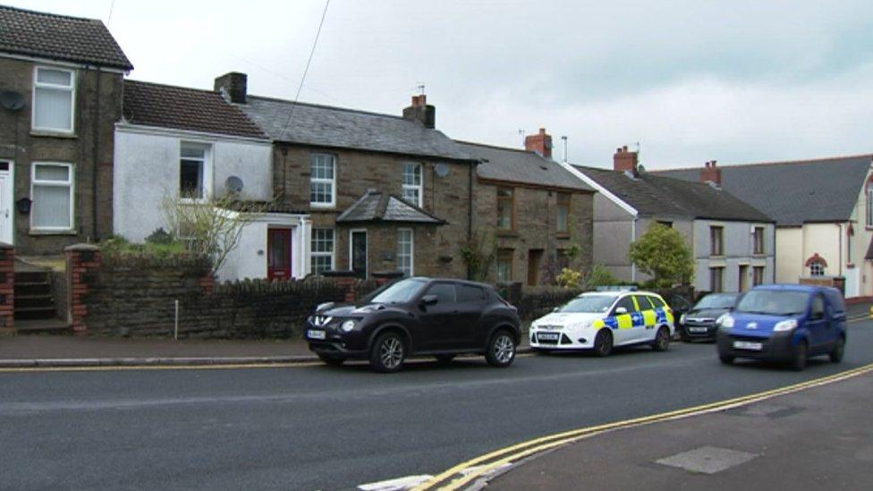 The body of the woman was found at a property in High Street in Nelson in Wednesday