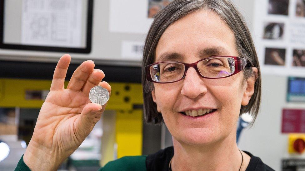 Helen Pankhurst holding the coin