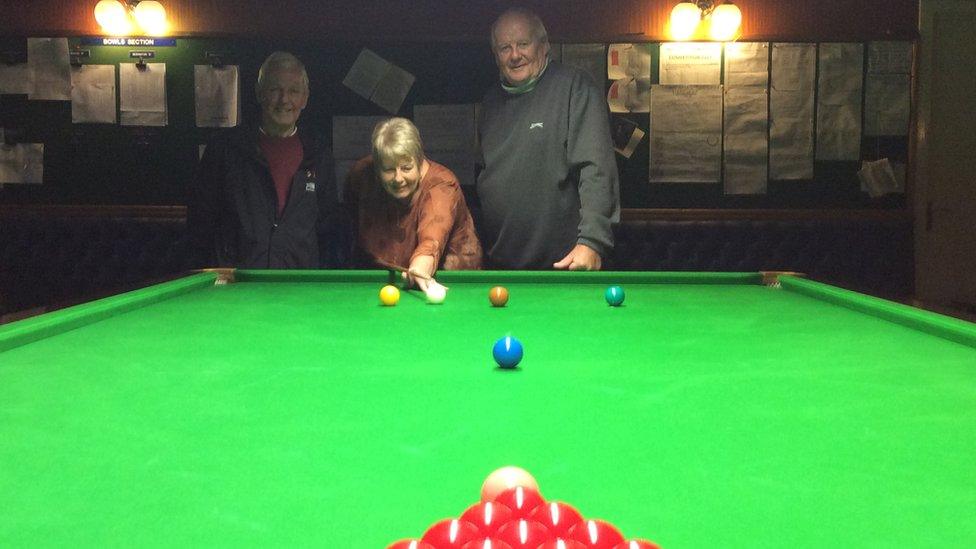 Roy McGunigall, Chairman of Oxton Conservative club, plays snooker with Eileen Newsham