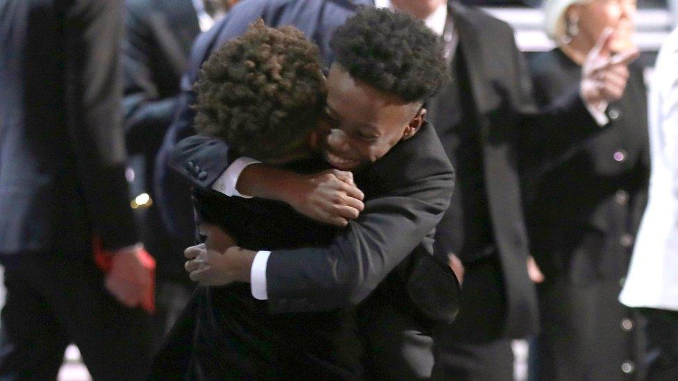 Jaden Piner and Alex R Hibbert embrace as 'Moonlight' wins the best picture award at the Oscars on Sunday, Feb. 26, 2017, at the Dolby Theatre in Los Angeles.