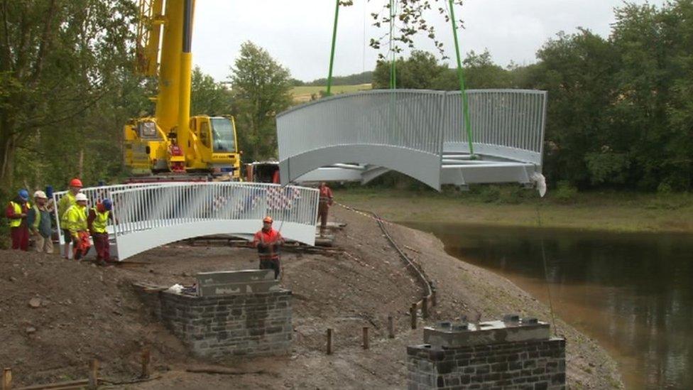 Bridge being moved into place