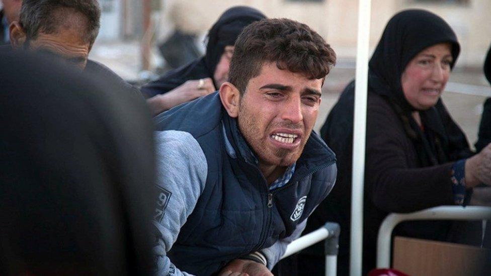 A man reacts following an earthquake in Sarpol-e Zahab county in Kermanshah, Iran November 13, 2017. Tasnim News Agency/Handout via REUTERS ATTENTION EDITORS