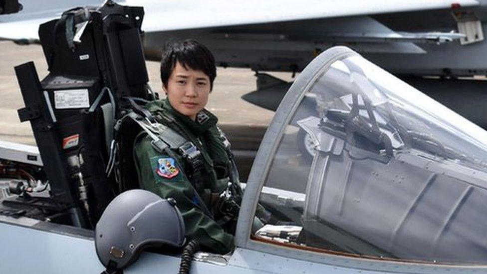 First Lieutenant Misa Matsushima of the Japan Air Self Defence Force poses in the cockpit of an F-15J air superiority fighter