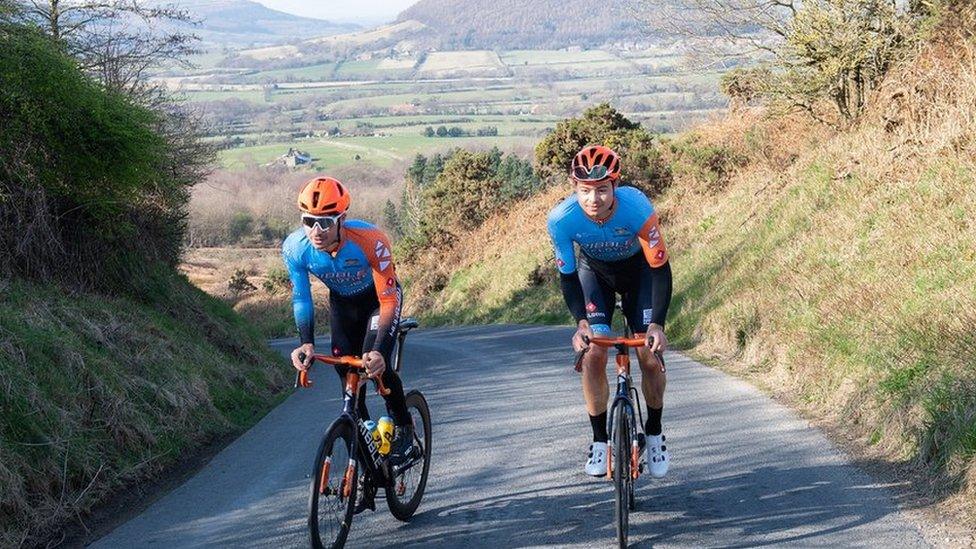 Brothers Charlie (left) and Harry Tanfield riding up Carlton Bank