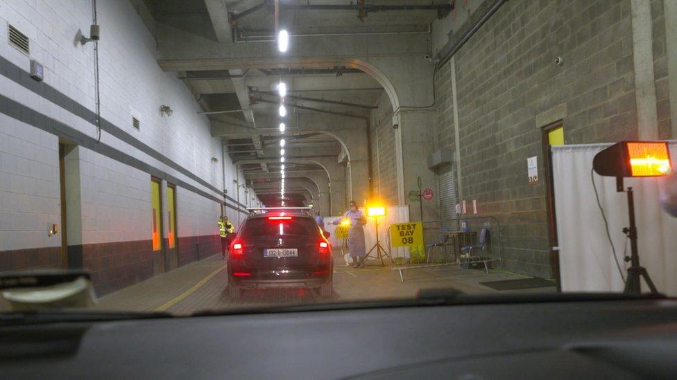 cars drive through testing centre