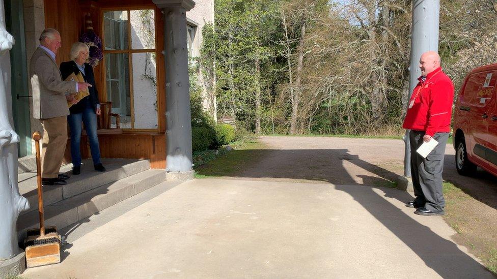 The Prince of Wales and Duchess of Cornwall greet their postman