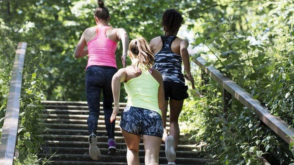 Women take part in a Mom In Balance back in shape class