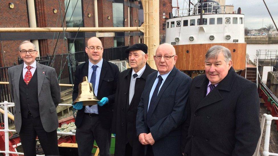 Men standing in front of the Arctic Corsair