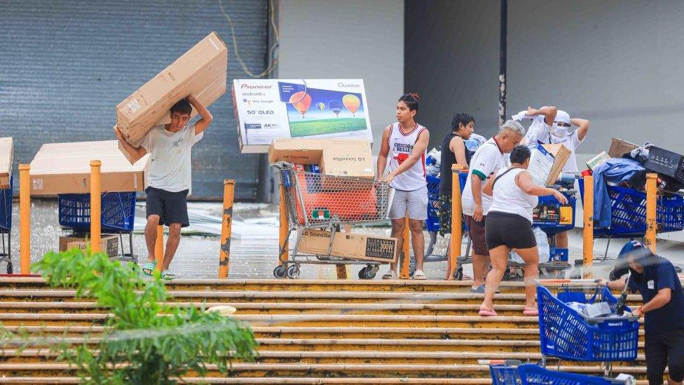 Looting of appliances in Walmart store, after hurricane Otis hit Acapulco on October 25, 2023 in Acapulco, Mexico