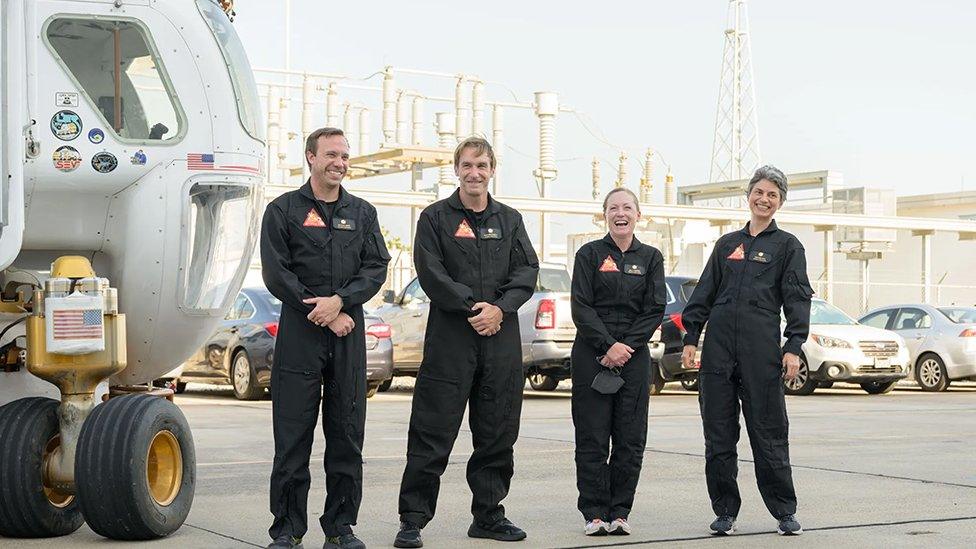 Left to right, Nathan Jones, Ross Brockwell, Kelly Haston, Anca Selariu in nasa uniform