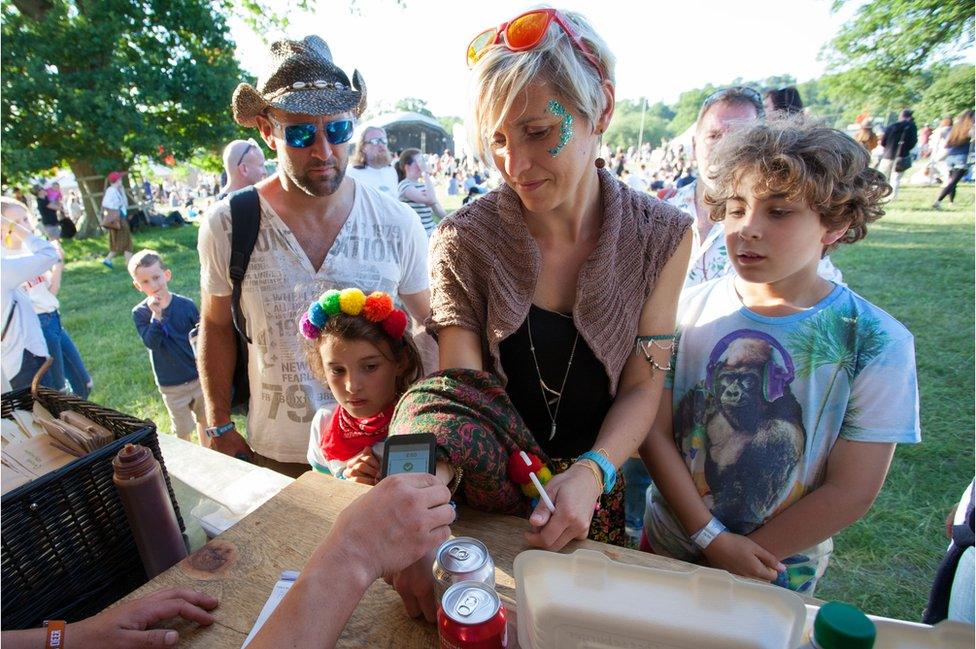 A family paying with a wristband at Black Deer festival