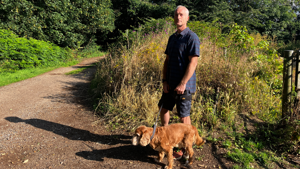 Dog walker in Orwell Country park