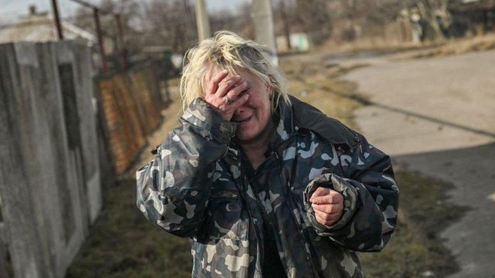 A woman cries near Bakhmut