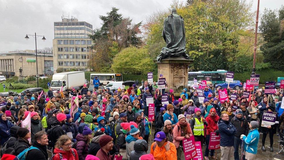 Staff gather outside university buildings in Bristol.