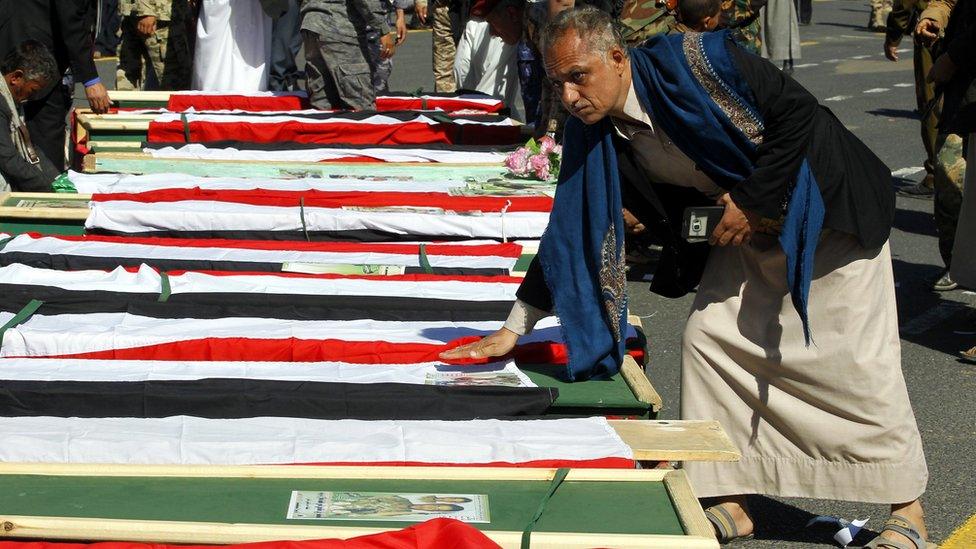 Houthi supporters gather around the coffins of Houthi fighters reportedly killed in recent clashes in Sanaa, Yemen (7 December 2017)