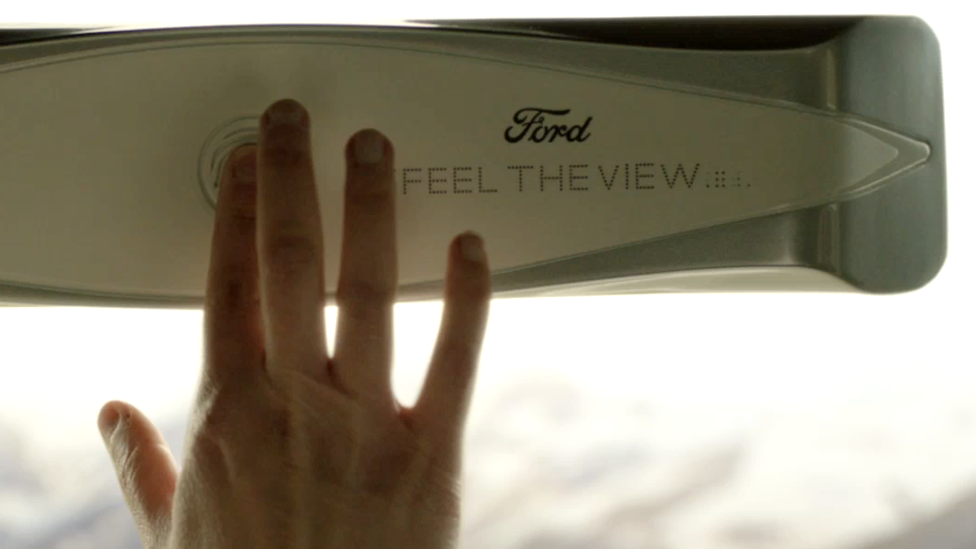 A hand turns on Ford's Feel the View windows