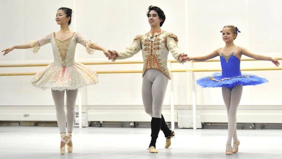 Charlie Tait with Yuhui Choe who plays the Sugar Plum Fairy and Benjamin Ella who dances the Prince