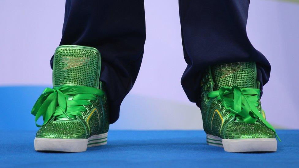 Lochte's green high-top sneakers