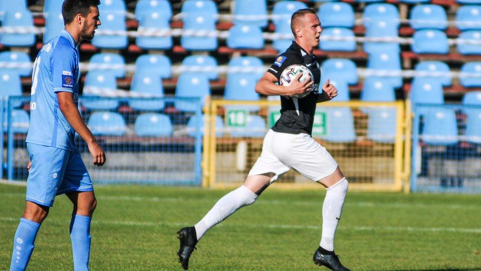 Mateusz Kuzimski (right) after scoring on his debut for Warta Poznan in the Polish Cup in August against Blekitni Stargard