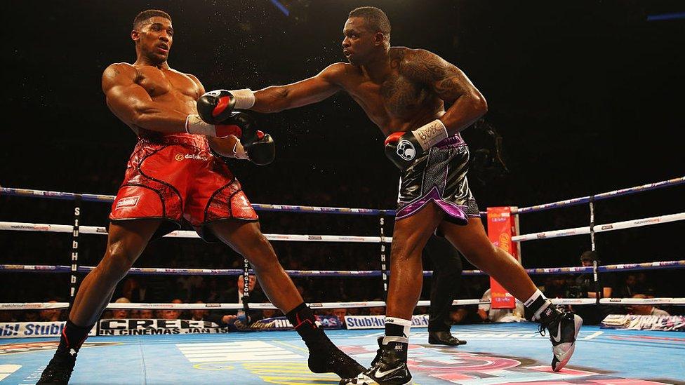 Anthony Joshua (L) and Dillian Whyte in action during the British and Commonwealth heavyweight title contest in 2015