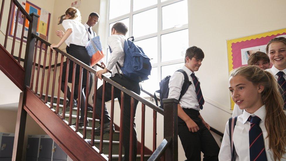 school pupils on stairs