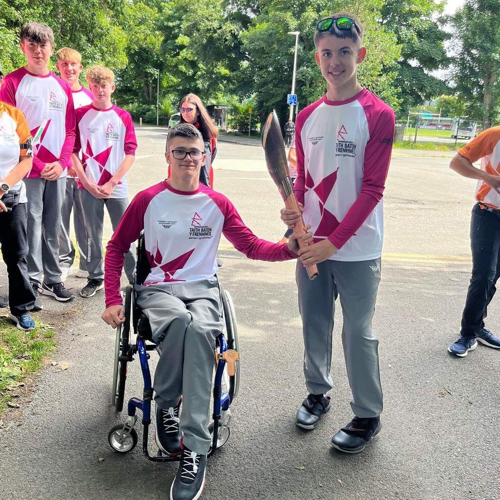 Kai at the Queens baton relay with another participant