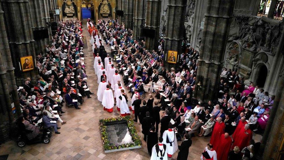 Members of the choir arrive at Westminster Abbey in central London on May 6, 2023, ahead of the coronations of Britain's King Charles III and Britain's Camilla, Queen Consort.