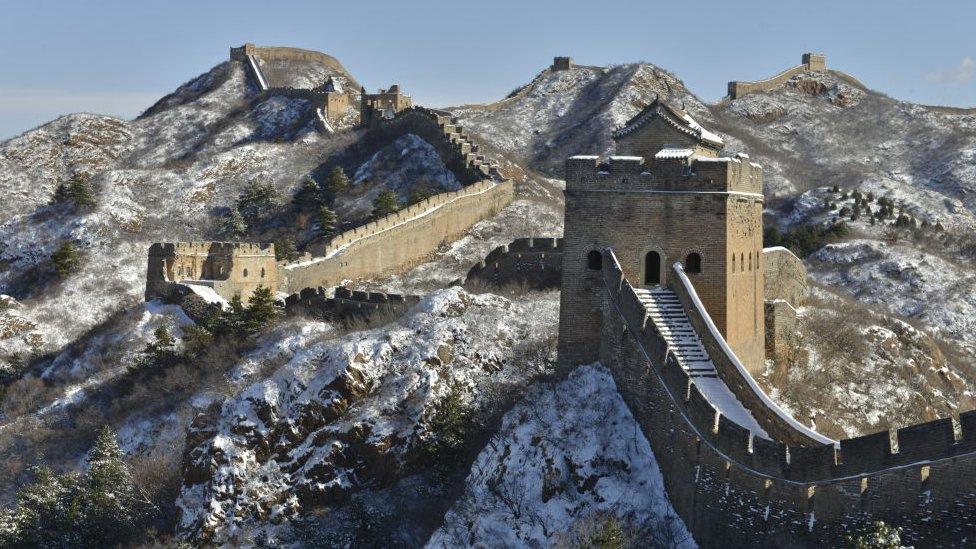 great wall of china stretching into the distance with snow on top