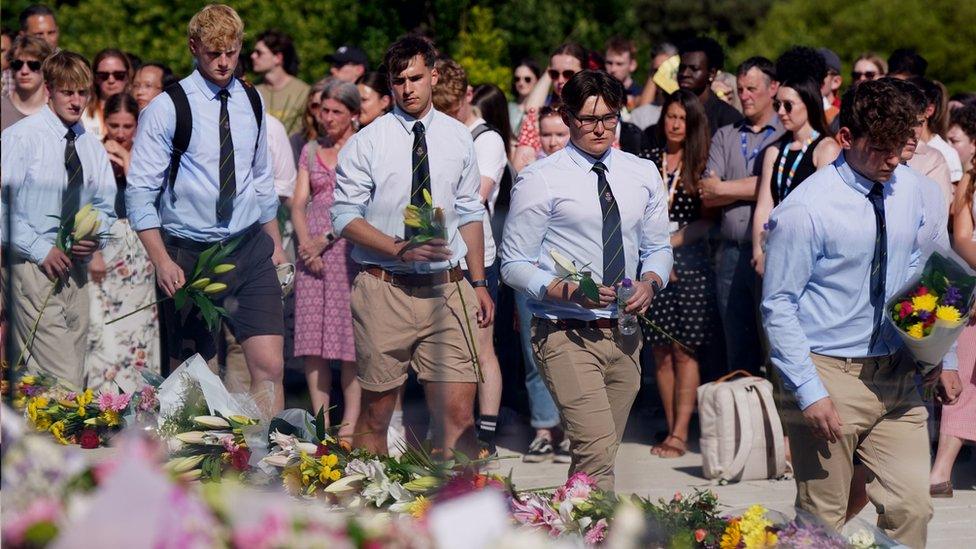 Barnaby Webber's team-mates laying flowers