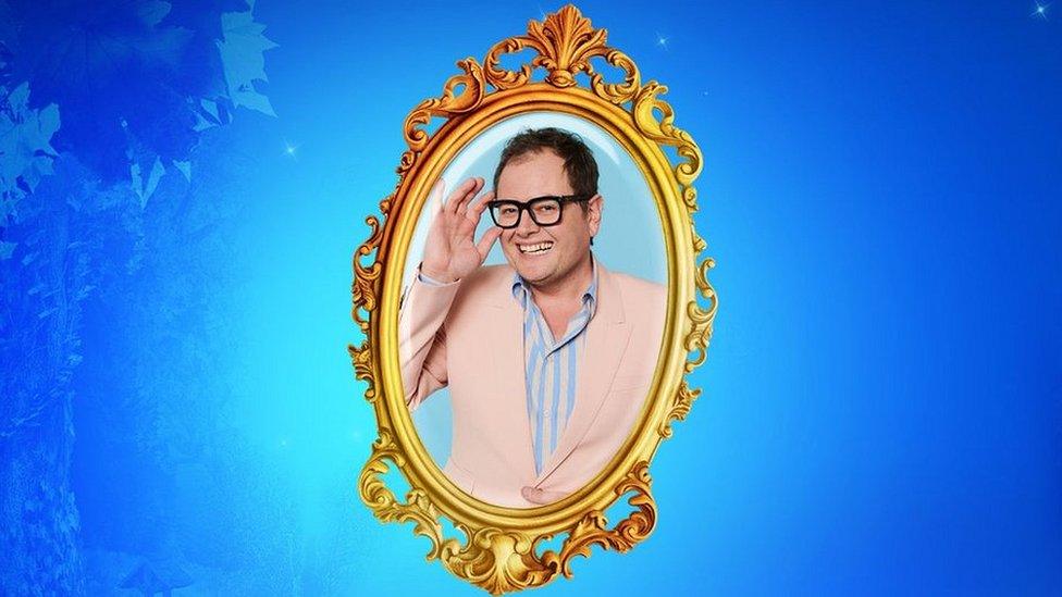 Picture of Alan Carr inside an oval mirror shape on a blue background