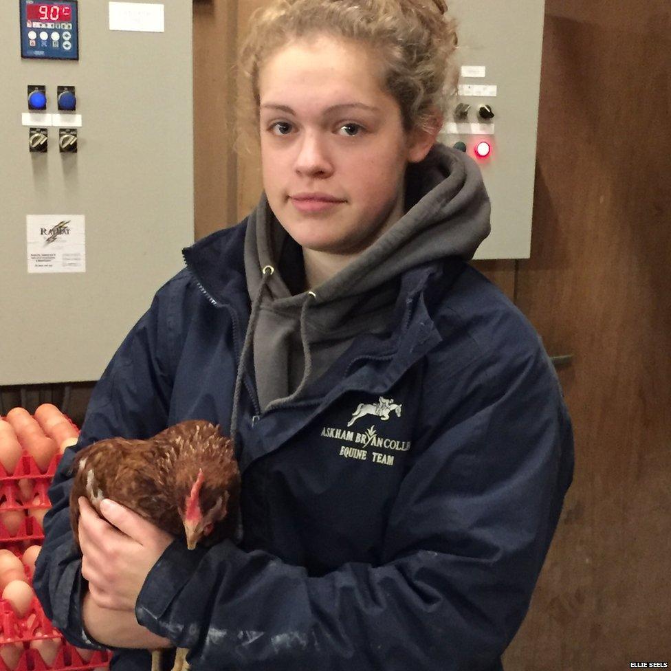 Ellie Seels holding a chicken