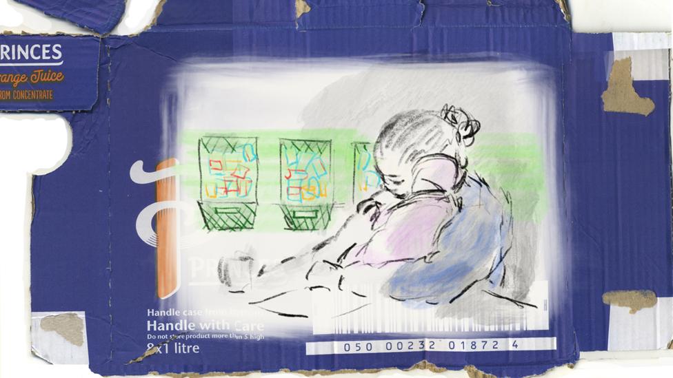 Woman cradling child - drawn on juice box