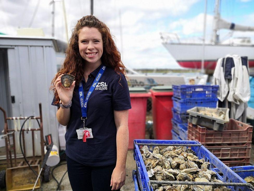 Celine Gamble holding oyster