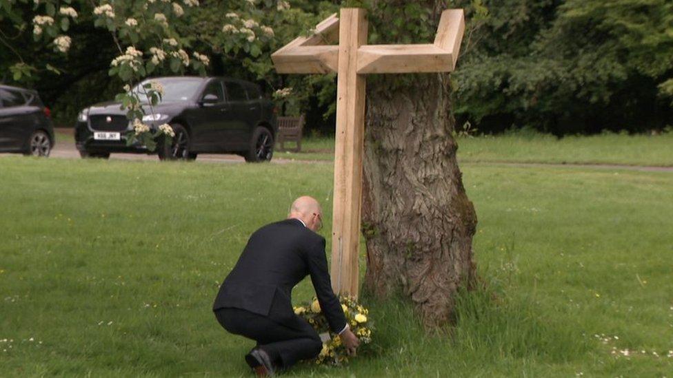 John Swinney lays a wreath