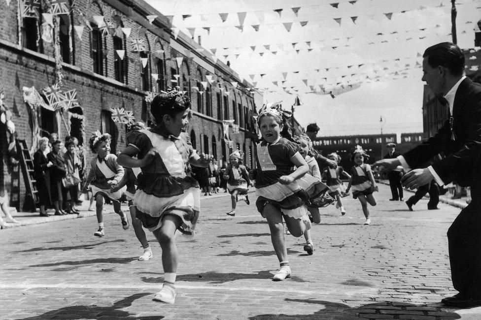 The children of Morpeth Street in London's East End enjoying a street party in celebration of the Coronation of Queen Elizabeth II