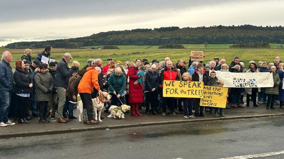 Protesters in anoraks