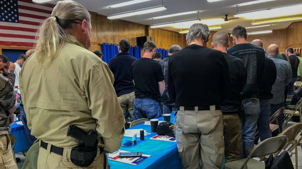 Militia groups are pictured at a meeting ahead of Monday's rally