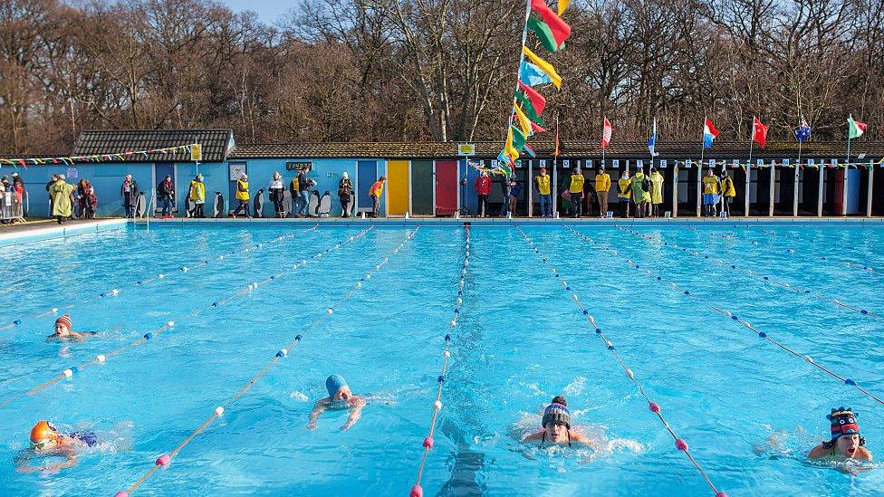 Lido with bunting and swimmers