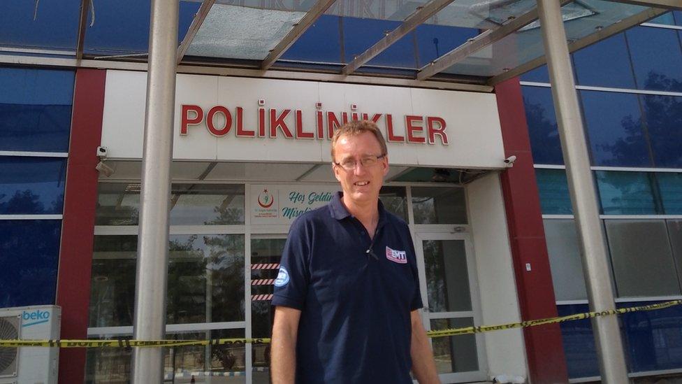 Obstetrician Paul Holmes is working in the grounds of a disused hospital which was damaged by the quake