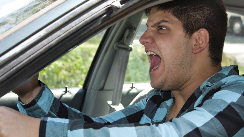 Man shouting in car