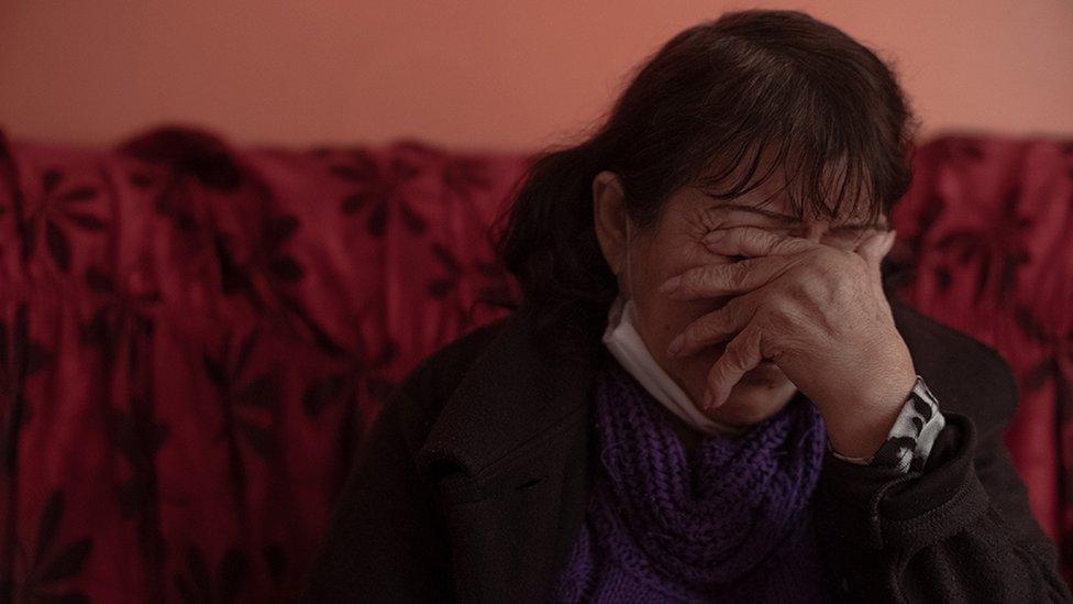 Teresa Salas Carrasco (67) in her home's living room, remembers the disappearance of her youngest daughter Alison Fernandez (30), who on the morning of August 13 went out to the local market and did not return home.