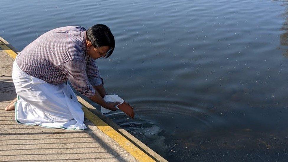 Radika Kadaba's father's ashes being put into the water