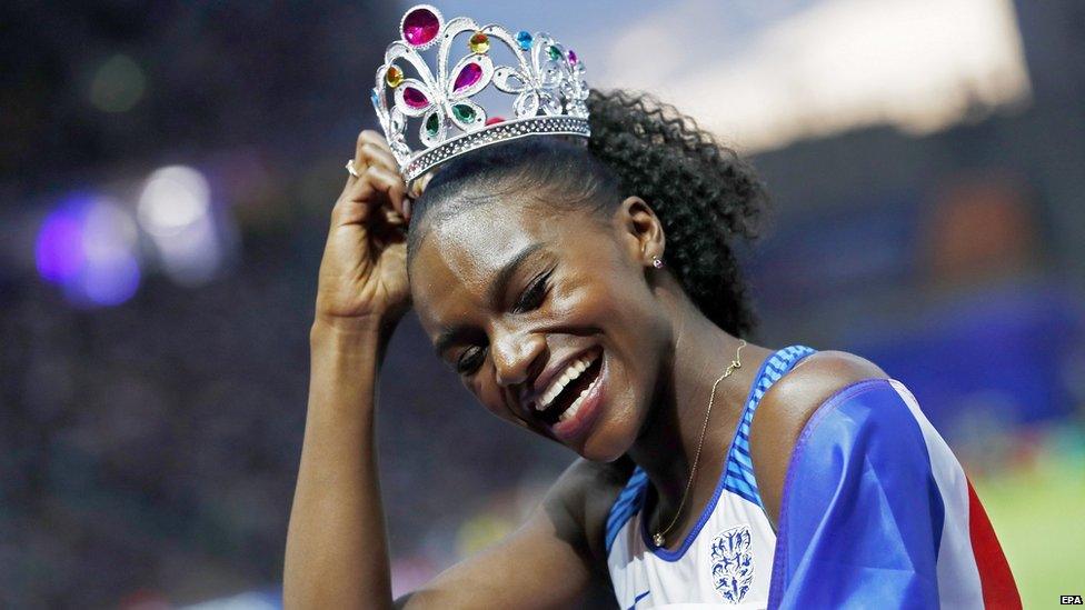 Dina Asher-Smith celebrates.