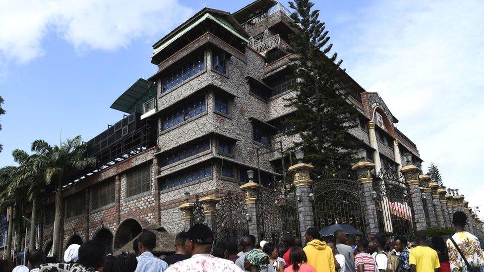 Residents and church members gather at the main gate of The Synagogue Church of All Nations headquarters to mourn the death of TB Joshua in Lagos, Nigeria - 6 June 2021