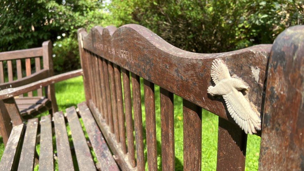 One of the memorial benches which has a bird on it