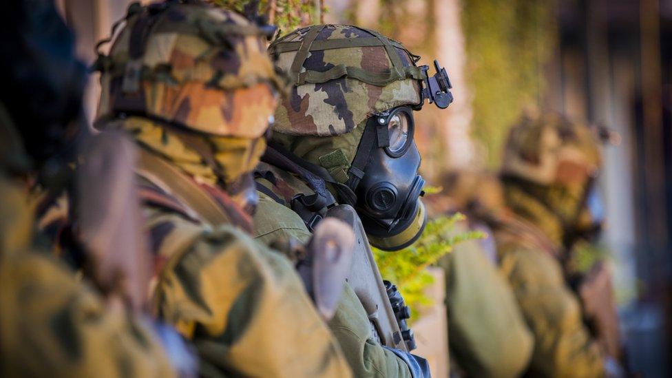 Irish soldier in gasmask