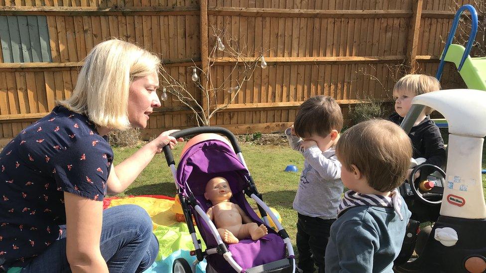 Hana Foltynova, with three children, in her back garden