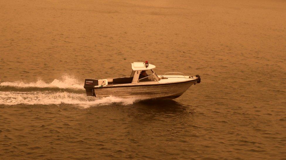 A police speedboat travels on the River Nile during a sandstorm in Cairo, Egypt, 16 January 2019