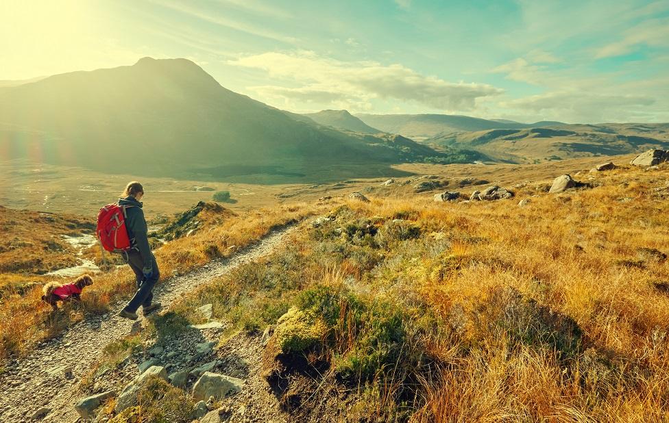 Hillwalker in Scottish countryside