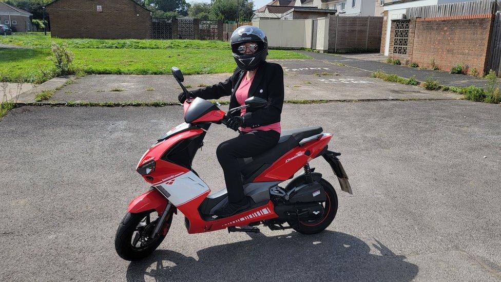 Doreen Marshall on a moped